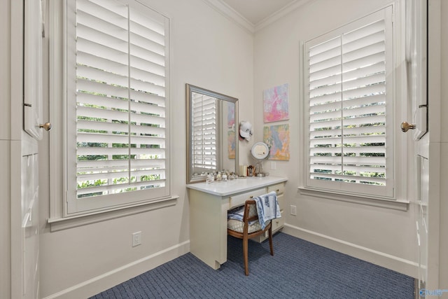 office area with ornamental molding, a wealth of natural light, and dark carpet