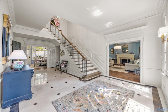 entrance foyer featuring ornamental molding