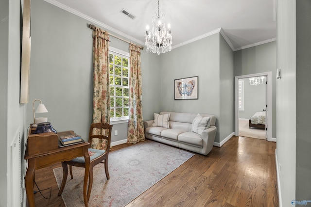 interior space with hardwood / wood-style flooring, ornamental molding, and an inviting chandelier