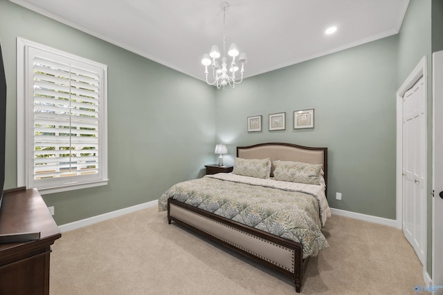 carpeted bedroom with ornamental molding and a chandelier