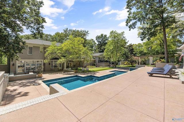 view of swimming pool featuring a patio