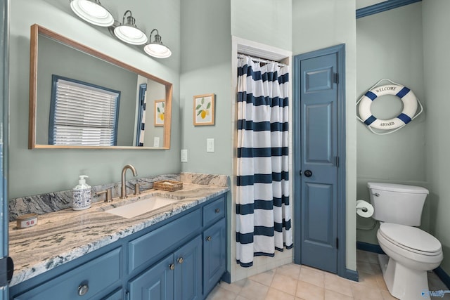 bathroom with tile patterned flooring, vanity, curtained shower, and toilet