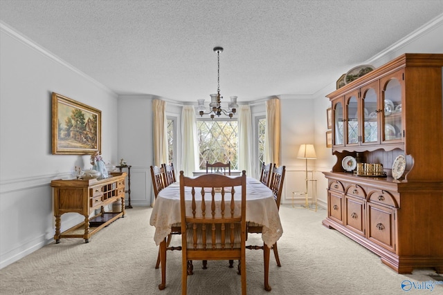 carpeted dining space with a chandelier, a textured ceiling, and crown molding