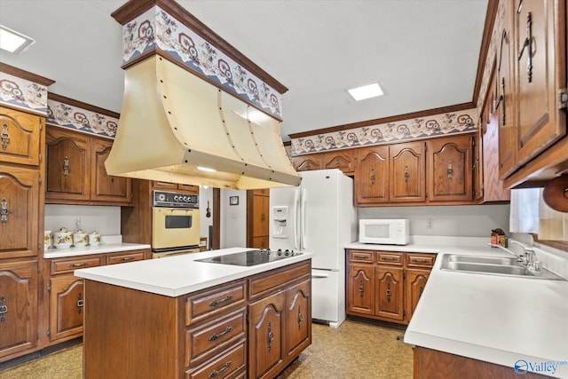 kitchen with island range hood, a center island, sink, crown molding, and white appliances