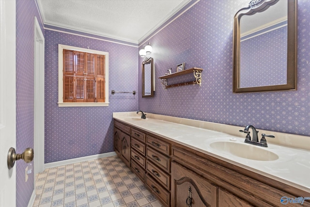 bathroom with vanity, a textured ceiling, and ornamental molding