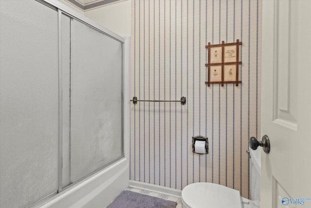 bathroom featuring tile patterned flooring and toilet