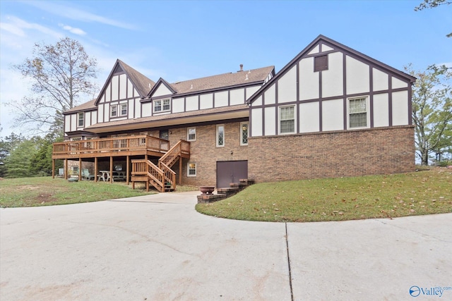 view of front facade featuring a front lawn and a wooden deck