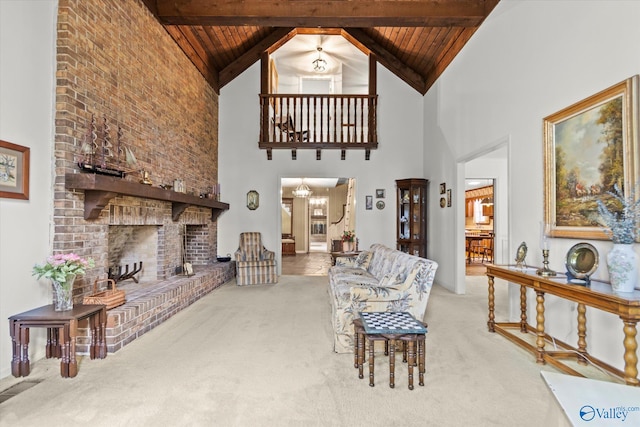 living room featuring beam ceiling, carpet flooring, wood ceiling, and high vaulted ceiling