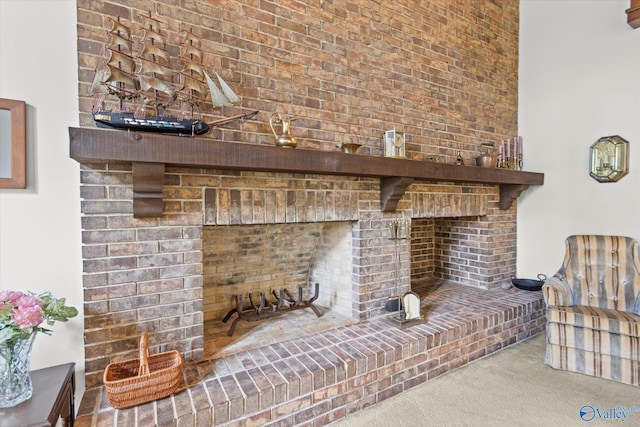 interior details with a fireplace and carpet floors