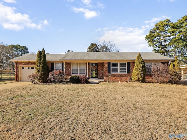 single story home featuring a front yard and a garage