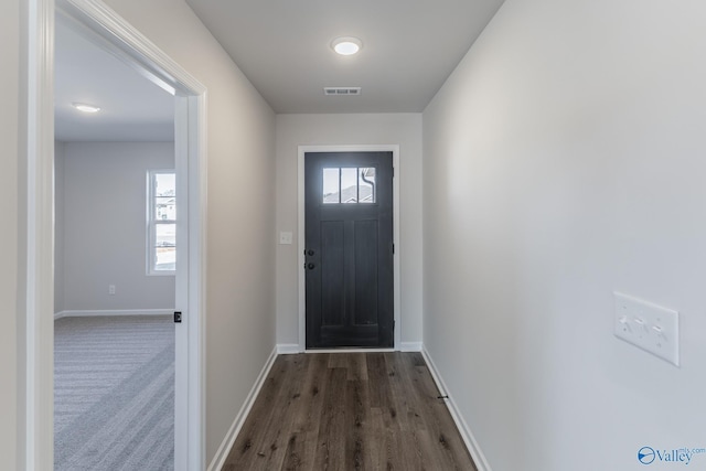 doorway to outside featuring dark hardwood / wood-style floors