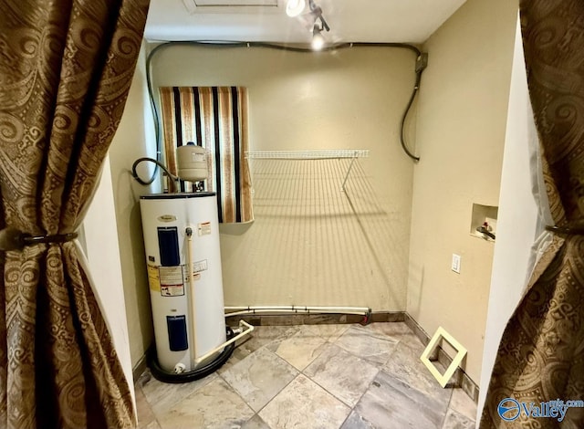 utilities with visible vents and electric water heater
