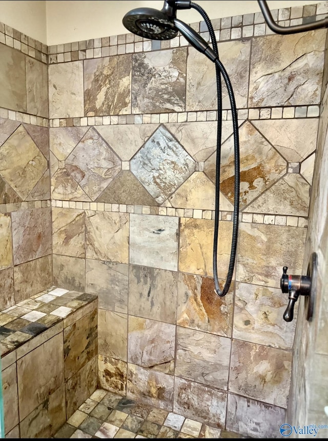 bathroom with tiled shower