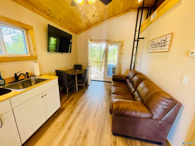 living room with lofted ceiling, sink, wooden ceiling, and plenty of natural light