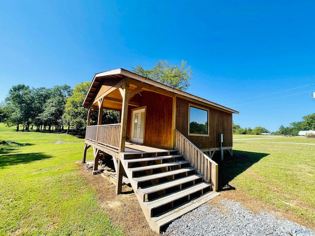 view of property exterior featuring a lawn