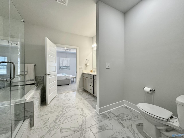 full bath featuring marble finish floor, a stall shower, toilet, and baseboards