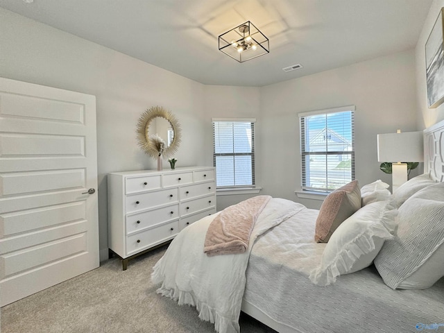 bedroom featuring visible vents and carpet floors