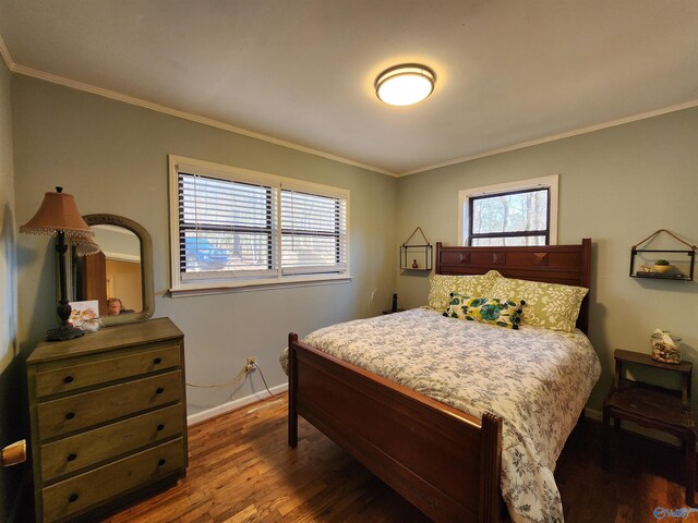 bedroom with multiple windows, crown molding, and dark hardwood / wood-style floors