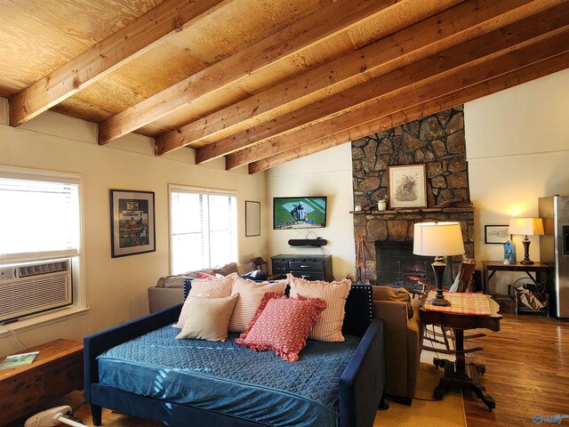 living room featuring wooden ceiling, lofted ceiling with beams, cooling unit, a stone fireplace, and hardwood / wood-style flooring