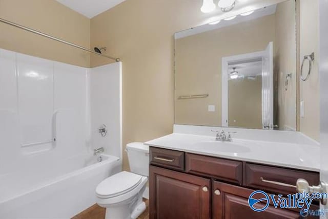 full bathroom with shower / bathing tub combination, vanity, and toilet