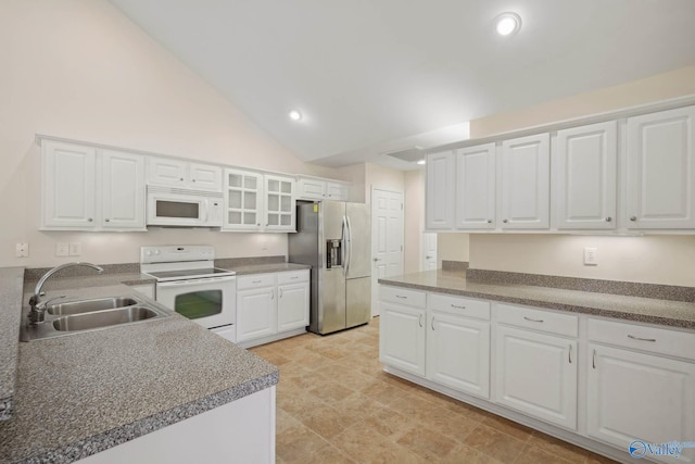 kitchen with glass insert cabinets, white appliances, white cabinetry, and a sink