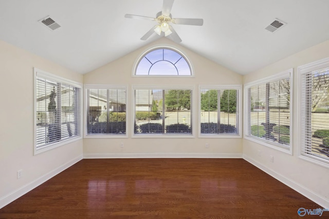 unfurnished sunroom with lofted ceiling, visible vents, and a ceiling fan