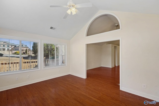 empty room with a ceiling fan, visible vents, baseboards, and wood finished floors