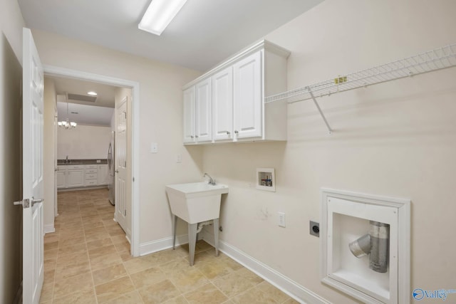 laundry area with washer hookup, cabinet space, electric dryer hookup, and baseboards