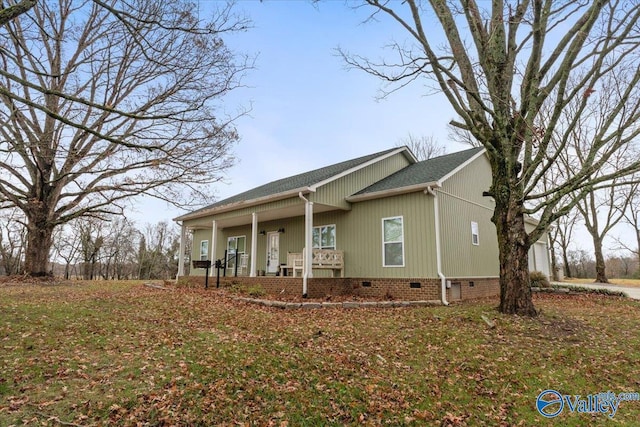 view of side of property featuring a porch