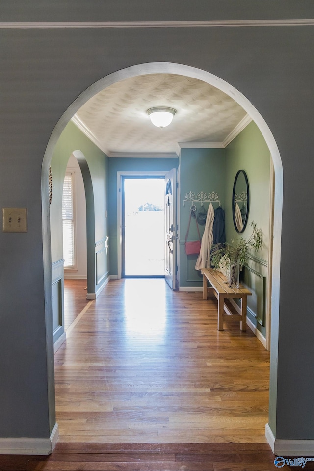 interior space featuring ornamental molding and hardwood / wood-style floors