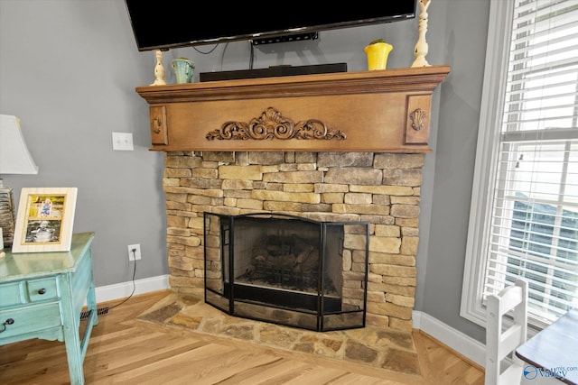 22915 Pin Oak Dr, Athens, AL 35613 - room details featuring baseboards, wood finished floors, and a stone fireplace
