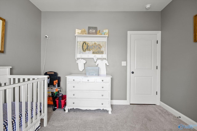 22915 Pin Oak Dr, Athens, AL 35613 - carpeted bedroom featuring a nursery area and baseboards
