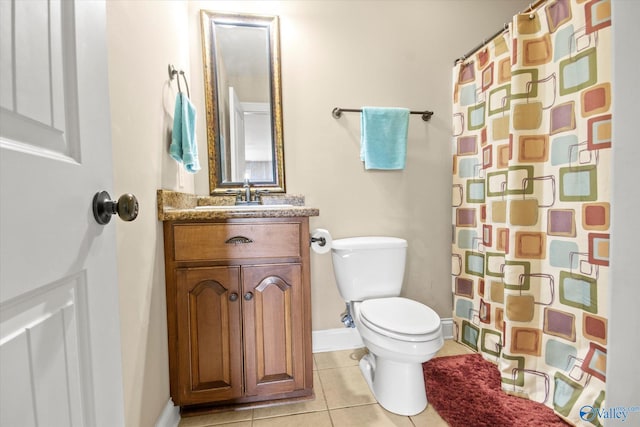 22915 Pin Oak Dr, Athens, AL 35613 - bathroom with a shower with shower curtain, toilet, vanity, baseboards, and tile patterned floors