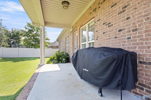 22915 Pin Oak Dr, Athens, AL 35613 - view of patio featuring fence and a grill