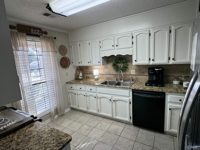 kitchen with a textured ceiling, white cabinets, dishwasher, sink, and light tile patterned floors