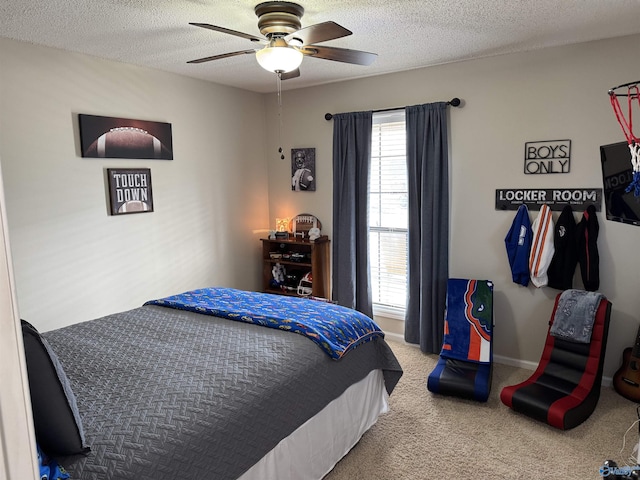 carpeted bedroom with a textured ceiling and ceiling fan