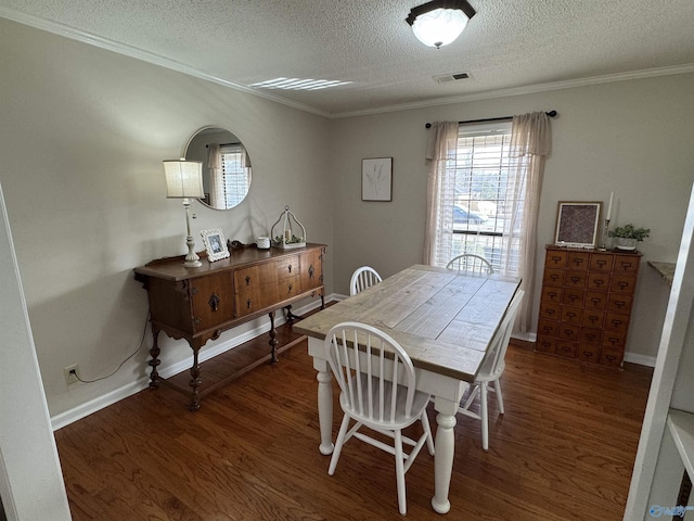 dining area with dark wood-type flooring, a textured ceiling, and crown molding