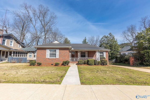 view of front facade featuring crawl space, a porch, a front yard, and brick siding