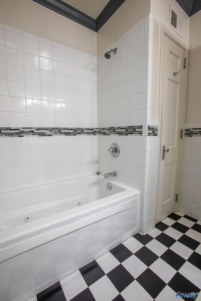 bathroom featuring visible vents, a combined bath / shower with jetted tub, ornamental molding, tile walls, and tile patterned floors