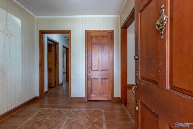 entrance foyer with wallpapered walls, parquet floors, baseboards, and ornamental molding