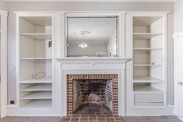 room details with an inviting chandelier, built in shelves, and a fireplace