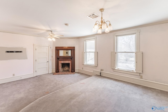 unfurnished living room featuring visible vents, a brick fireplace, crown molding, baseboards, and carpet