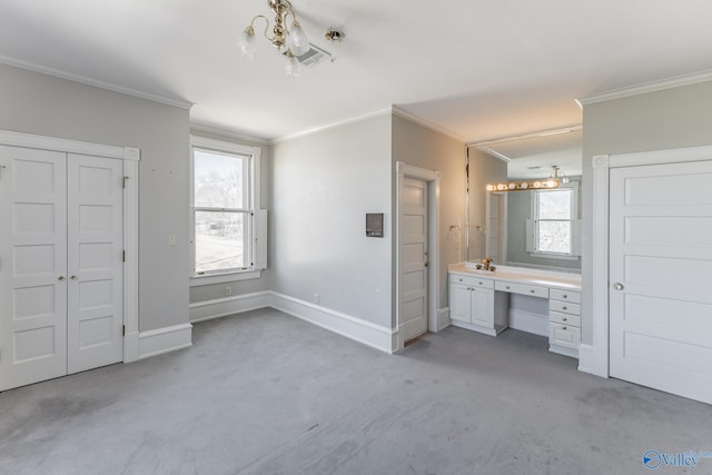 unfurnished bedroom featuring visible vents, light carpet, ornamental molding, ensuite bathroom, and baseboards