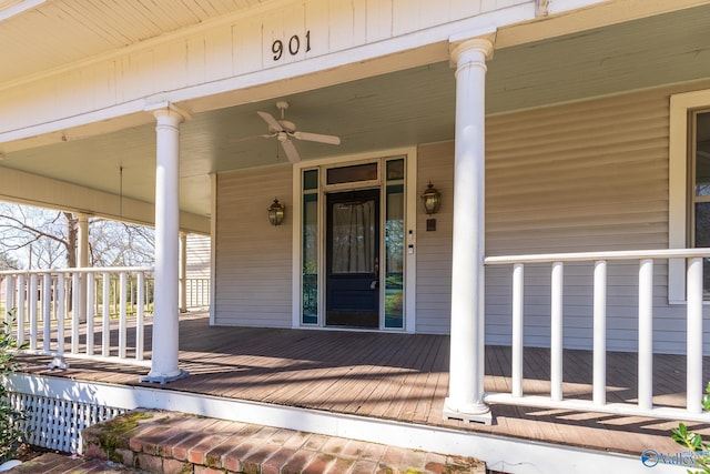 doorway to property with covered porch and a ceiling fan