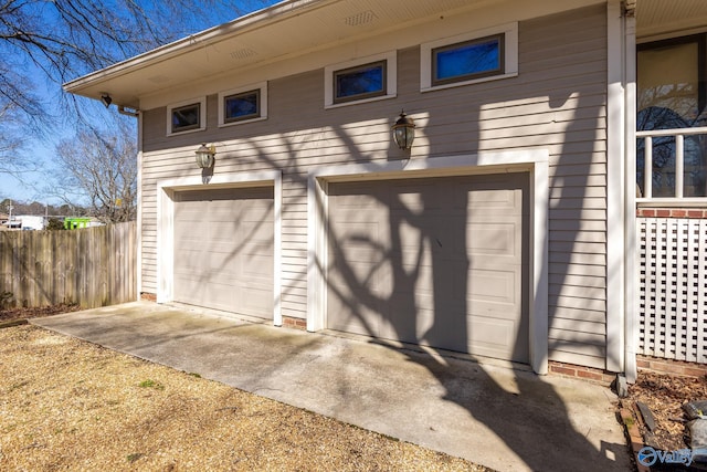 garage with fence