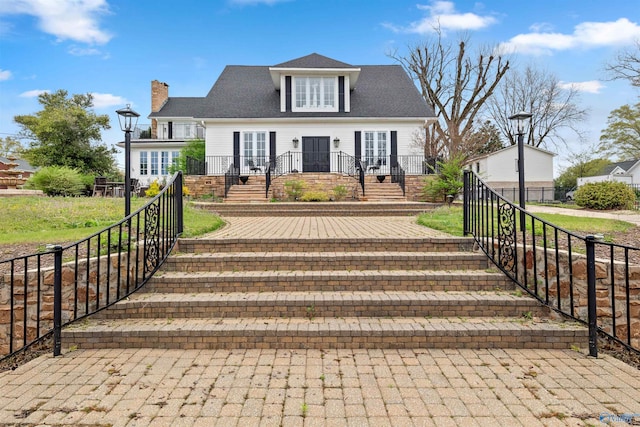 702 5th Ave SE, Cullman, AL 35055 - view of front facade with fence private yard and a chimney