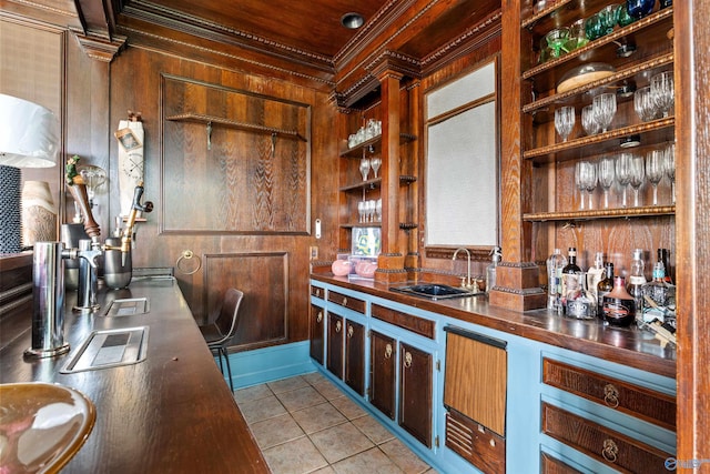 702 5th Ave SE, Cullman, AL 35055 - bar featuring light tile patterned floors, crown molding, wood walls, a sink, and bar
