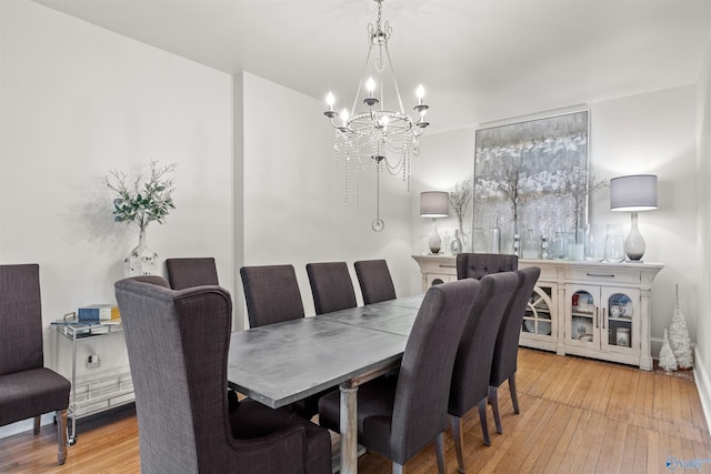 702 5th Ave SE, Cullman, AL 35055 - dining space featuring light wood finished floors and an inviting chandelier