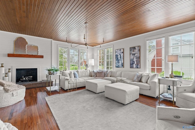 702 5th Ave SE, Cullman, AL 35055 - living area with a fireplace, dark wood-style flooring, wood ceiling, and crown molding