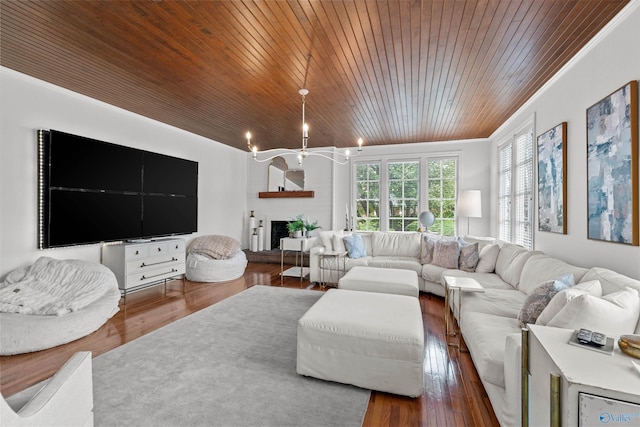 702 5th Ave SE, Cullman, AL 35055 - living area with crown molding, wooden ceiling, wood finished floors, and a fireplace with raised hearth